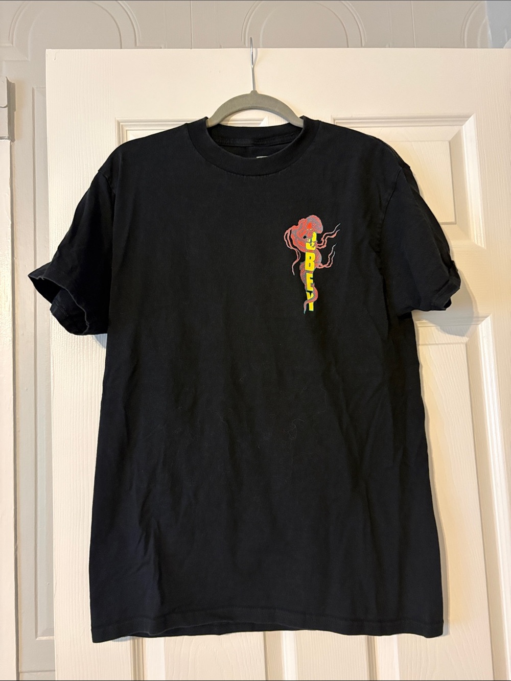 Obey Black Tee with Neon Floral Vertical Logo